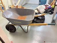 Full left-side view showing tub, handles, wheels