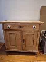 Front view of pine server showing drawer, doors, knobs and hardware