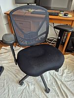 Front view of black mesh office chair