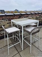 IKEA Segeron bar table with four stools assembled on patio