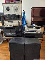 Full stack showing Sony reel-to-reel, Technics amplifier, Yamaha receiver and cassette deck with two black speakers