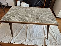 Full view of rectangular coffee table on cloth