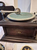 Front view showing Columbia Grafonola decal and green felt turntable