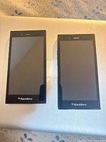 Front view of two BlackBerry Leap phones powered off