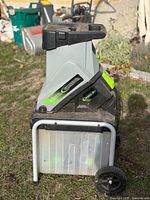 Side view showing Earthwise branding, hopper, frame and collection bin