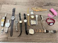 Full layout of all watch heads and strap pieces on tabletop