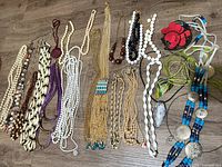 full layout of the 27 necklaces showing variety of styles and colors