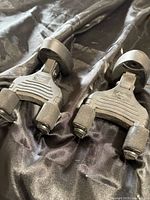 Two Donner guitar hangers on fabric backdrop