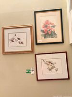Overview of all three framed artworks on wall