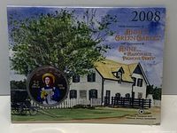 Front of sealed coin card with colourized coin displayed