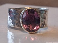 Front view of hammered sterling band with oval amethyst