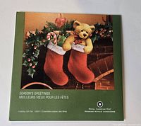 Front of Season’s Greetings coin set folder
