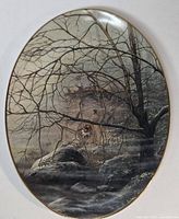 Front view of oval collector plate showing full artwork and gold rim