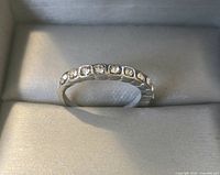 Ring displayed flat showing front stones