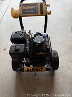 Front view of DeWalt 3400 PSI pressure washer showing frame, wheels and engine