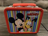 Front of lunchbox showing Mickey and Pluto design