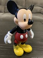 Front view of Mickey Mouse vinyl figurine standing on table