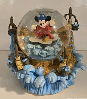 Full view of Disney Sorcerer's Apprentice musical snow globe showing Mickey figure and sculpted base