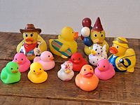 All 13 rubber ducks grouped on tabletop
