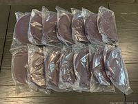 15 sealed Epicure omelet makers laid out on table