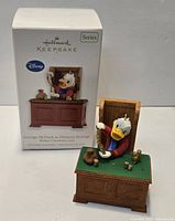 Ornament displayed in front of its Hallmark Keepsake box