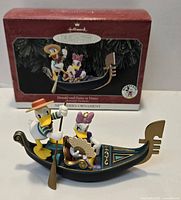 Front view of Donald and Daisy in Venice ornament with original box