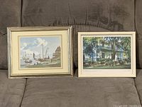 Both framed prints side by side on sofa