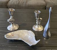 Group shot of fish tray, sculpture, and candlesticks