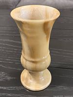 Full view of the carved onyx/alabaster vase showing color, shape and size