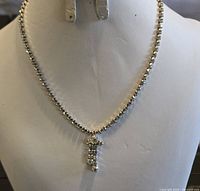 Full view of rhinestone necklace displayed on bust