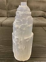 Front view of raw carved selenite tower lamp base