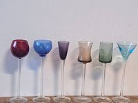 Front view of six multicolor liquor glasses showing colors and style