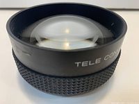 Oblique view showing front element and knurled barrel