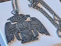 Front view of Sterling silver Thunderbird pendant on chain