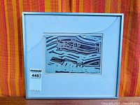 Framed print showing full framing and cracked glazing