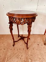 Full view of carved Rococo side table front angle
