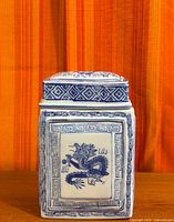 Front view showing dragon panel and Greek key border