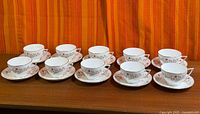 All ten tea cup and saucer sets displayed in two rows