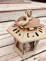 Top view showing pagoda roof, hanging ring and rust patina