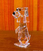 Full side view of Swarovski Pluto crystal figurine