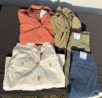 Group view of coral jacket, white jacket, olive pants, navy pants