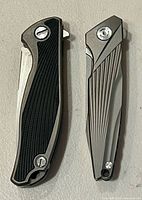 Both knives closed showing handle designs