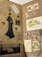 Open pages with die-cut lady in blue gown, children, horse, flowers, lake photograph