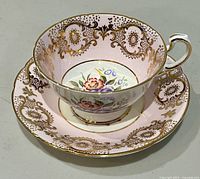 Cup on saucer top view showing pattern and gilt