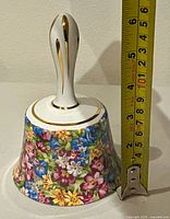 Full bell with tape measure showing height