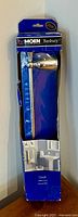 Front view of packaged Moen Banbury towel bar