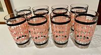 front view of all eight Hazel Atlas pink argyle tumblers