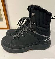 Side profile of left boot showing overall design and lacing