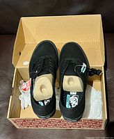 Top view of both Vans Comfycush shoes in original box
