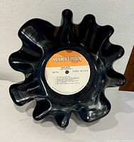 Top view of ruffled vinyl record bowl showing label